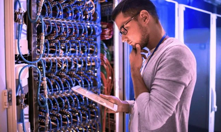 it network engineer looking at tablet